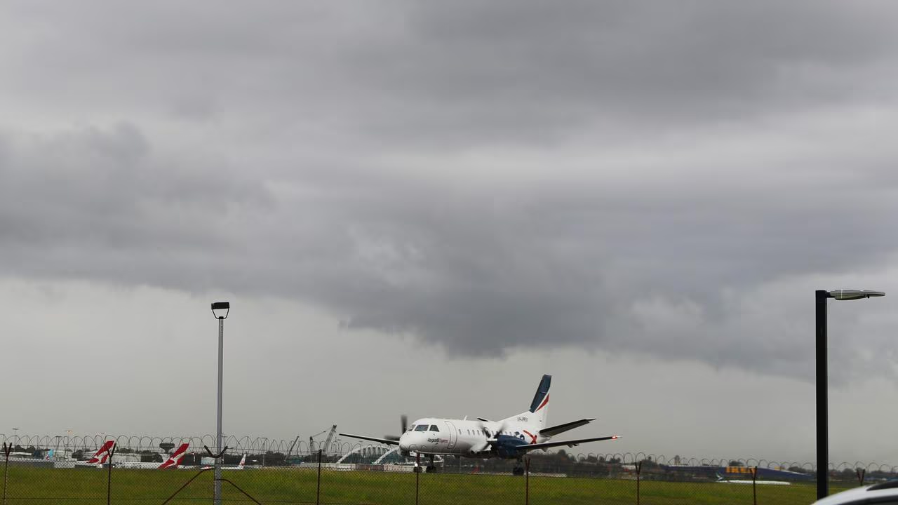 Severe weather causes major disruption at Sydney Airport, leading to dozens of flight cancellations.